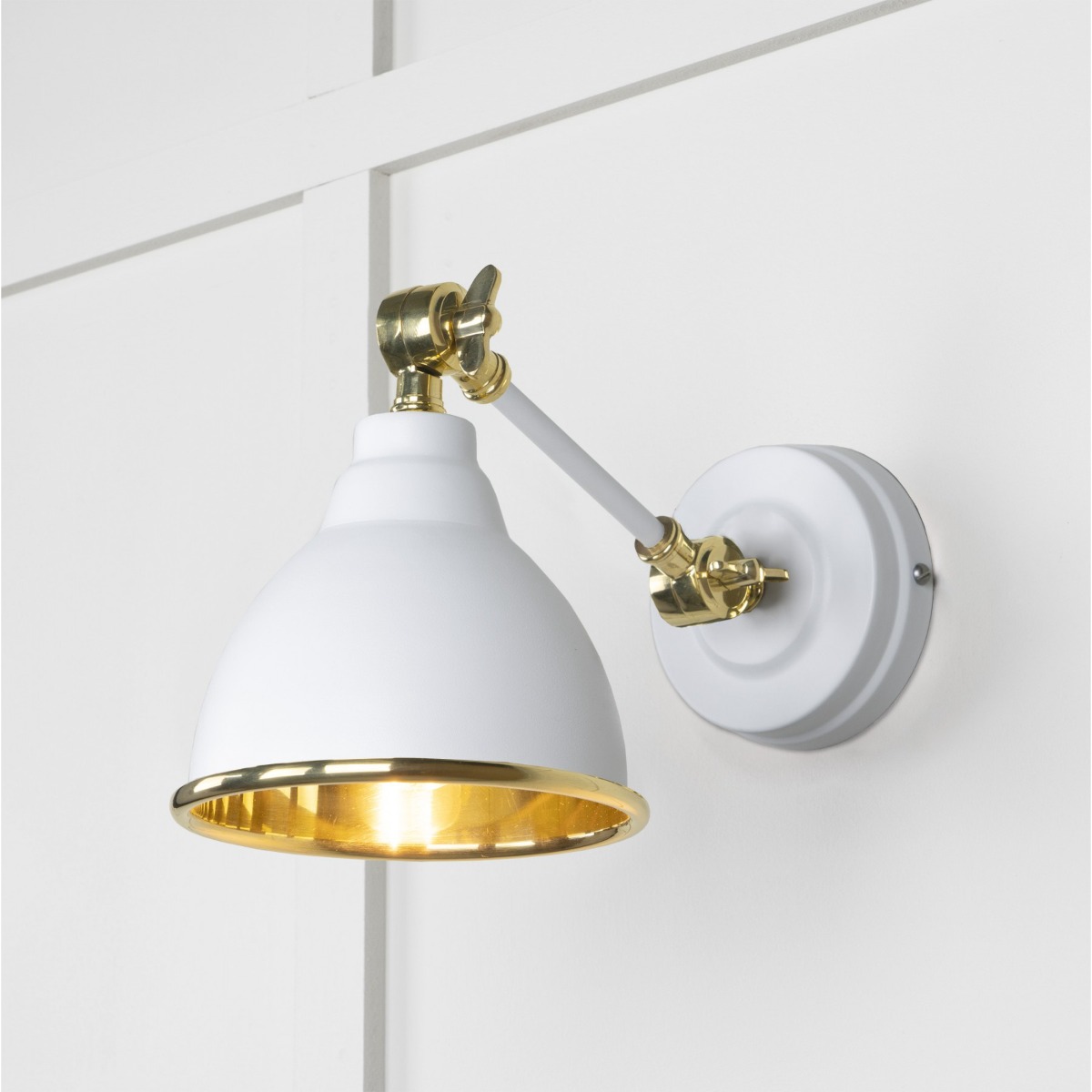 From the Anvil Smooth Brass Brindley Wall Light in Flock 49716SF