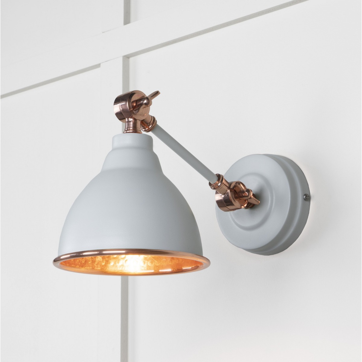 From the Anvil Hammered Copper Brindley Wall Light in Birch 49717SBI