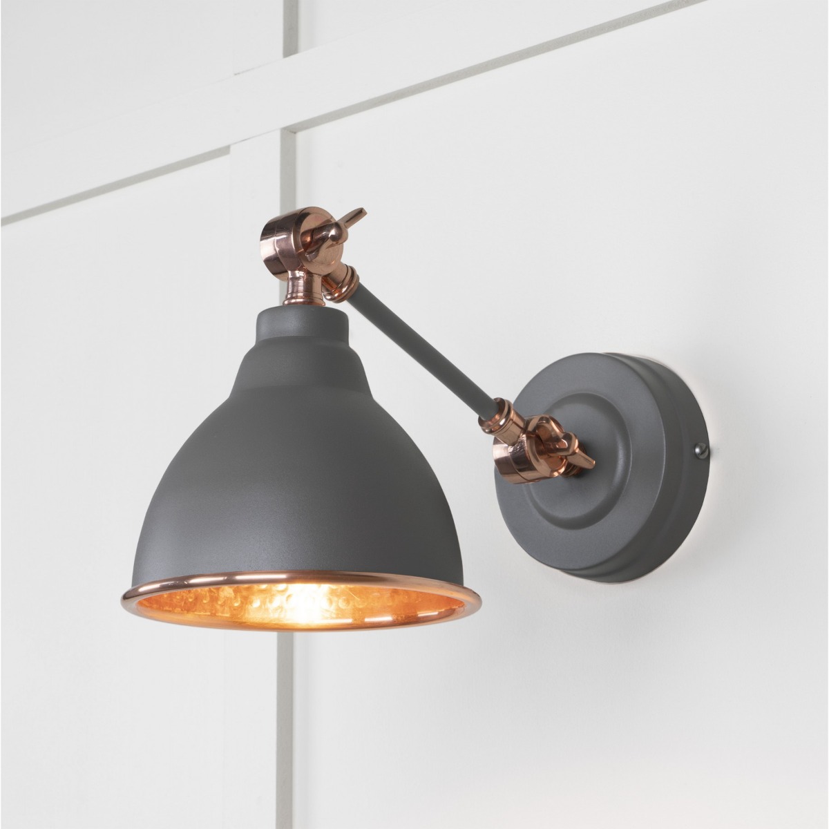 From the Anvil Hammered Copper Brindley Wall Light in Bluff 49717SBL