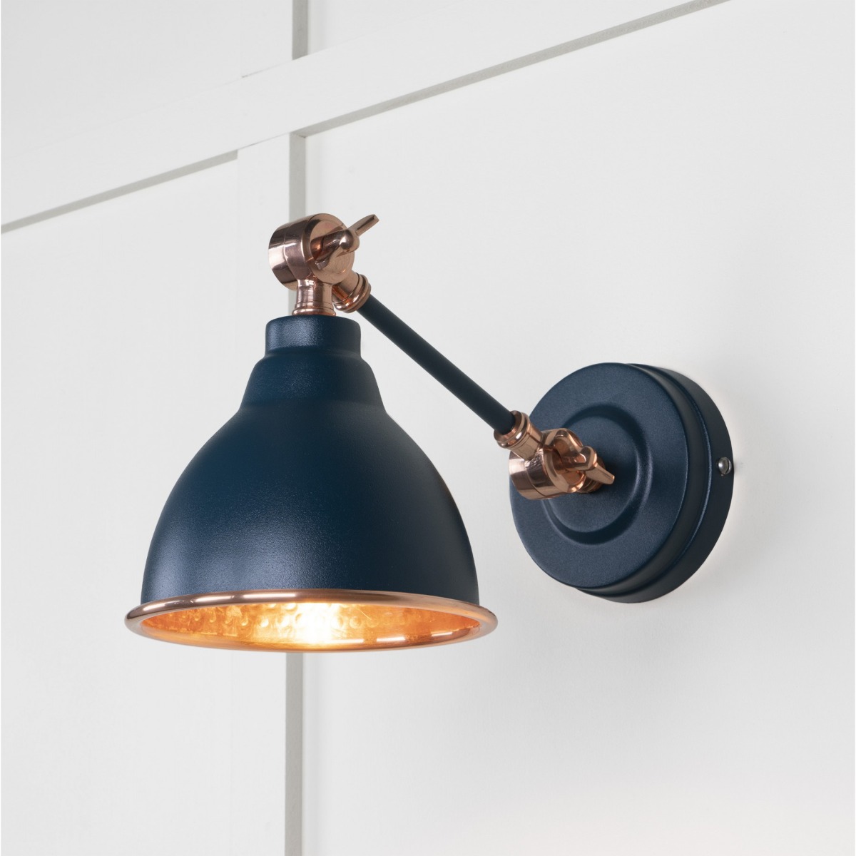 From the Anvil Hammered Copper Brindley Wall Light in Dusk 49717SDU