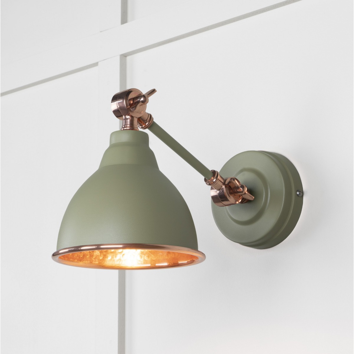 From the Anvil Hammered Copper Brindley Wall Light in Tump 49717STU