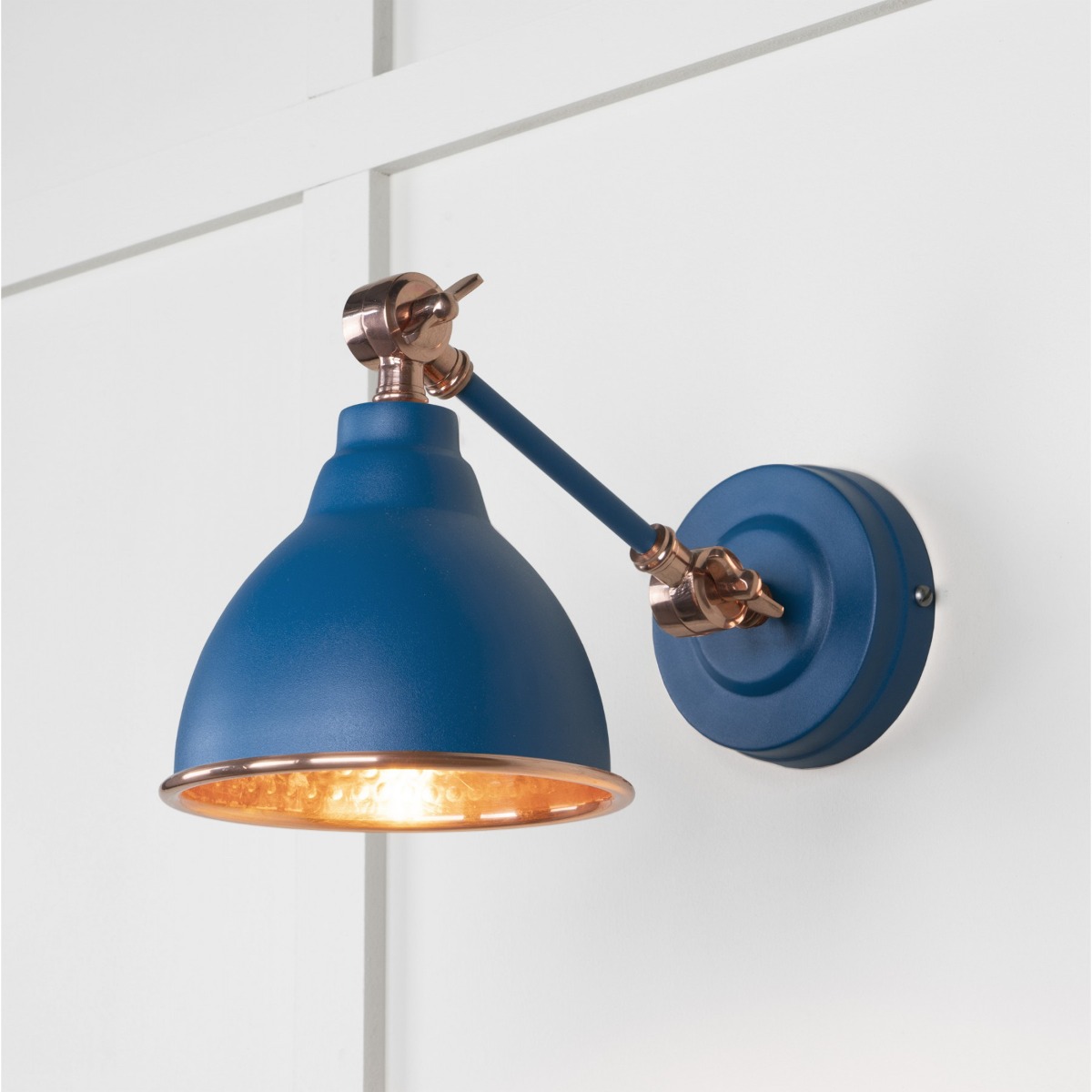 From the Anvil Hammered Copper Brindley Wall Light in Upstream 49717SU
