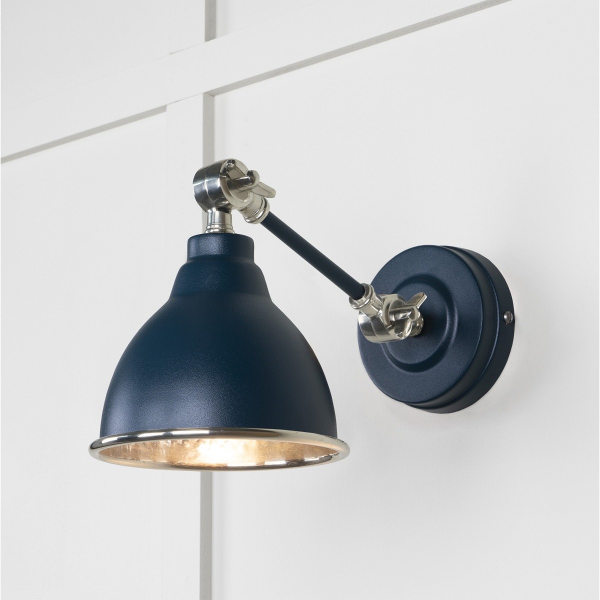 From the Anvil Hammered Nickel Brindley Wall Light in Dusk 49718SDU