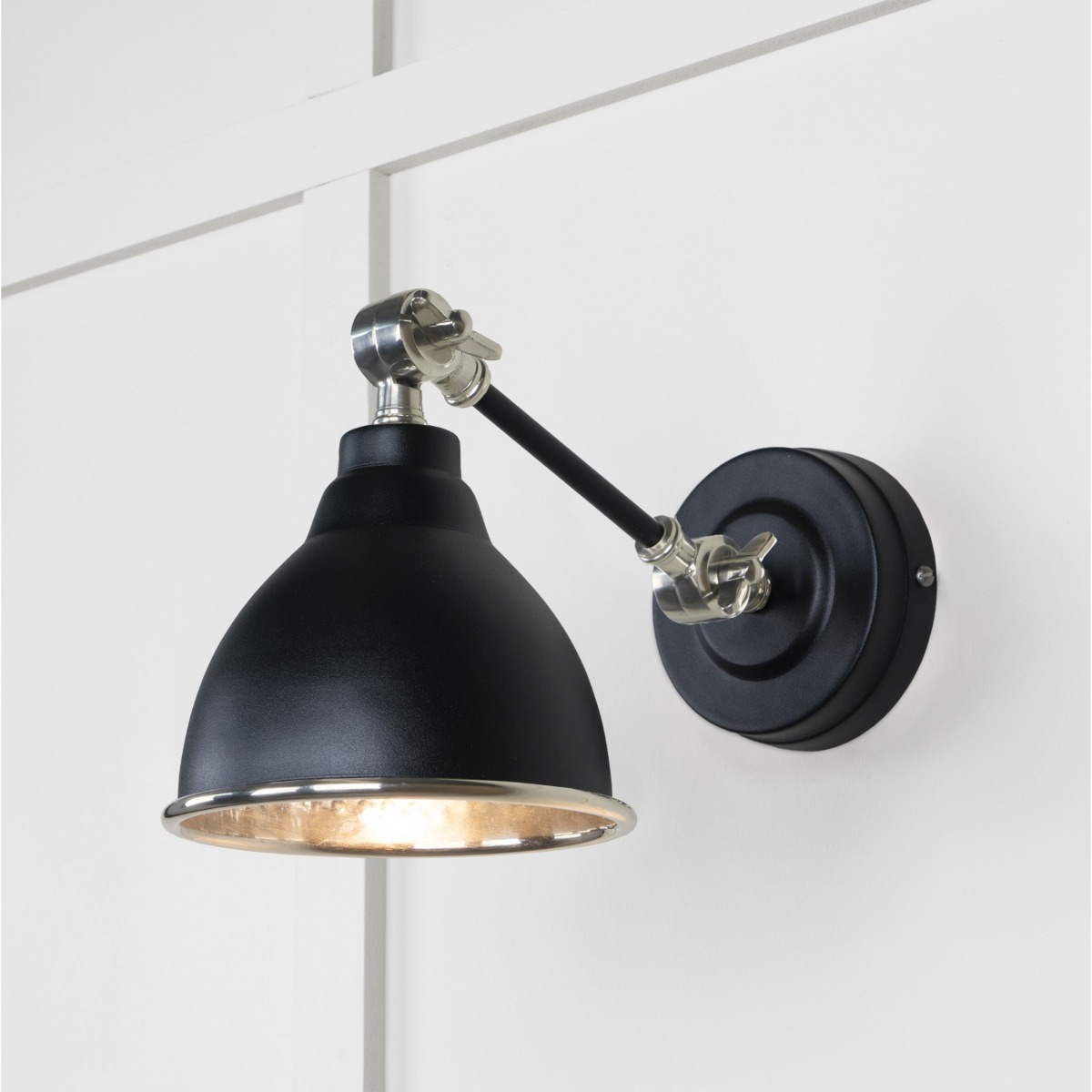 From the Anvil Hammered Nickel Brindley Wall Light in Elan Black 49718SEB