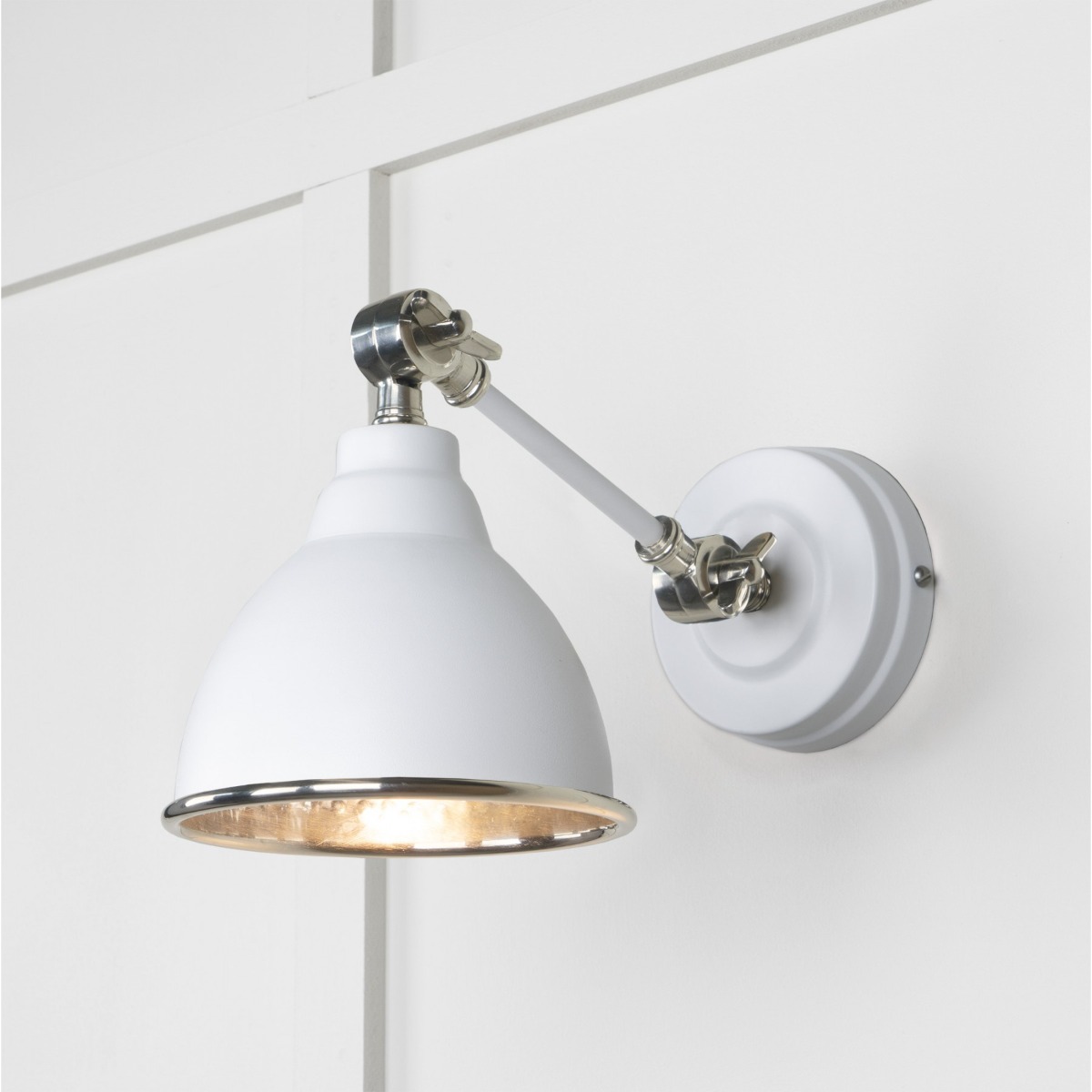 From the Anvil Hammered Nickel Brindley Wall Light in Flock 49718SF