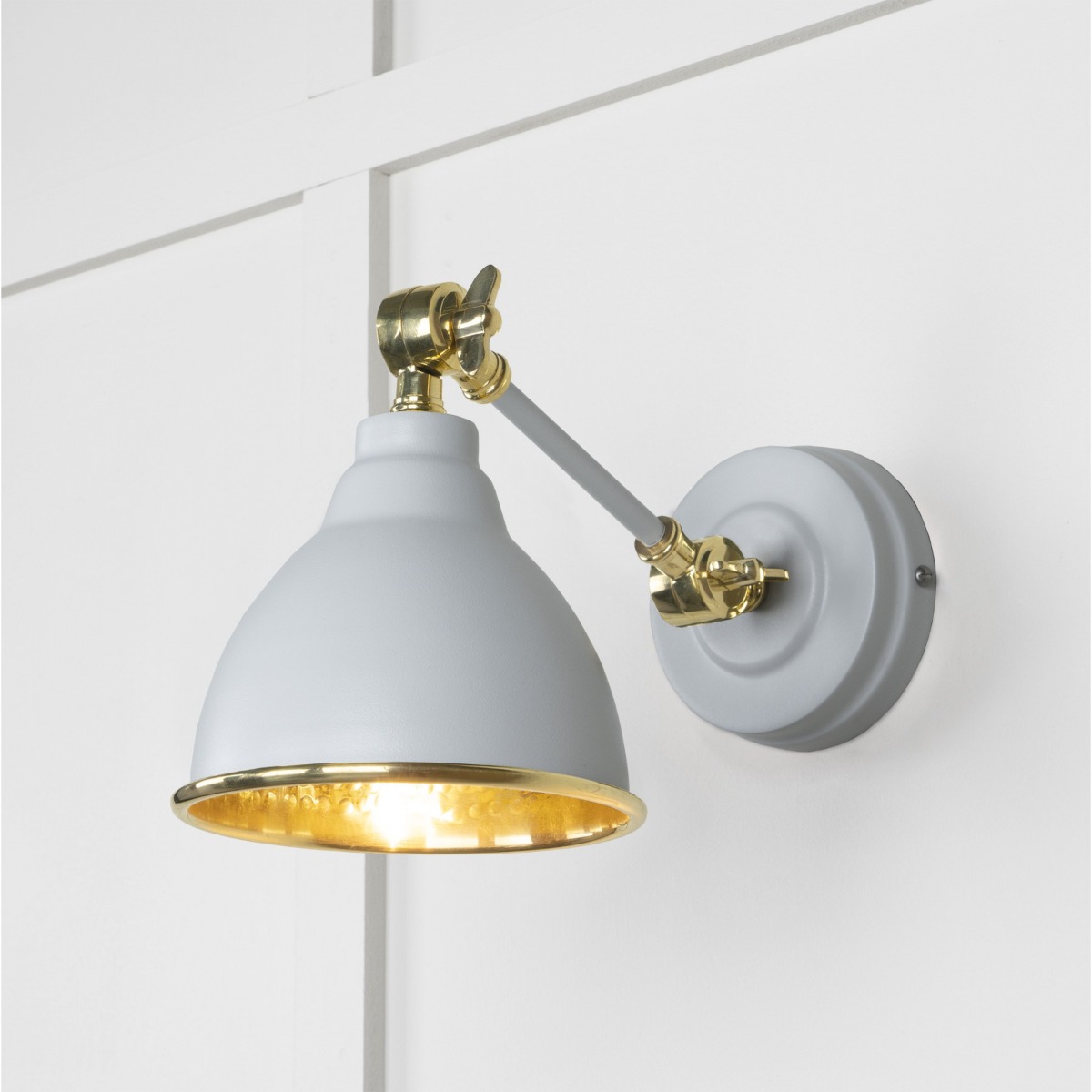 From the Anvil Hammered Brass Brindley Wall Light in Birch 49719SBI