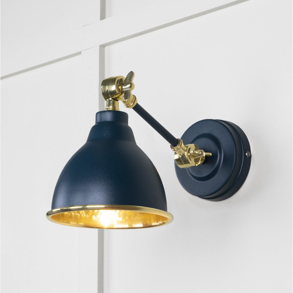 From the Anvil Hammered Brass Brindley Wall Light in Dusk 49719SDU