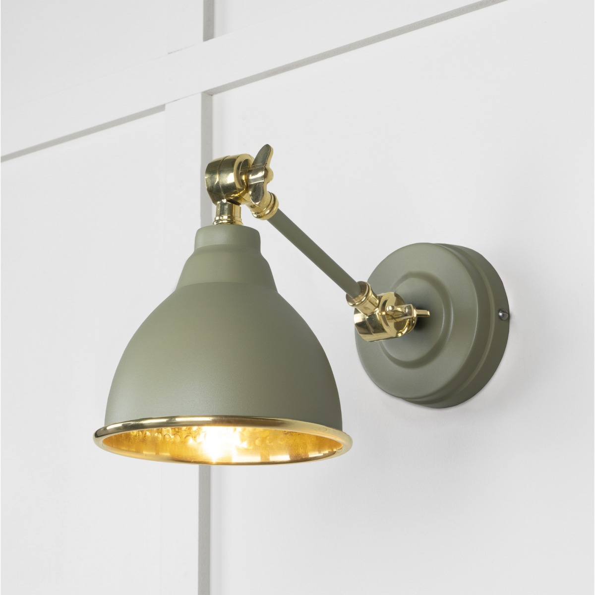 From the Anvil Hammered Brass Brindley Wall Light in Tump 49719STU