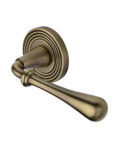 Heritage Brass Door Handle Lever Latch on Round Rose Roma Reeded Design Antique Brass 
  RR7156-AT