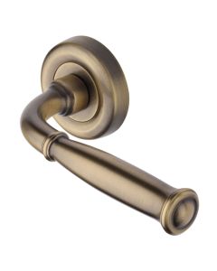 Heritage Brass Door Handle Lever Latch on Round Rose Lincoln Design Antique Brass 
  V1938-AT