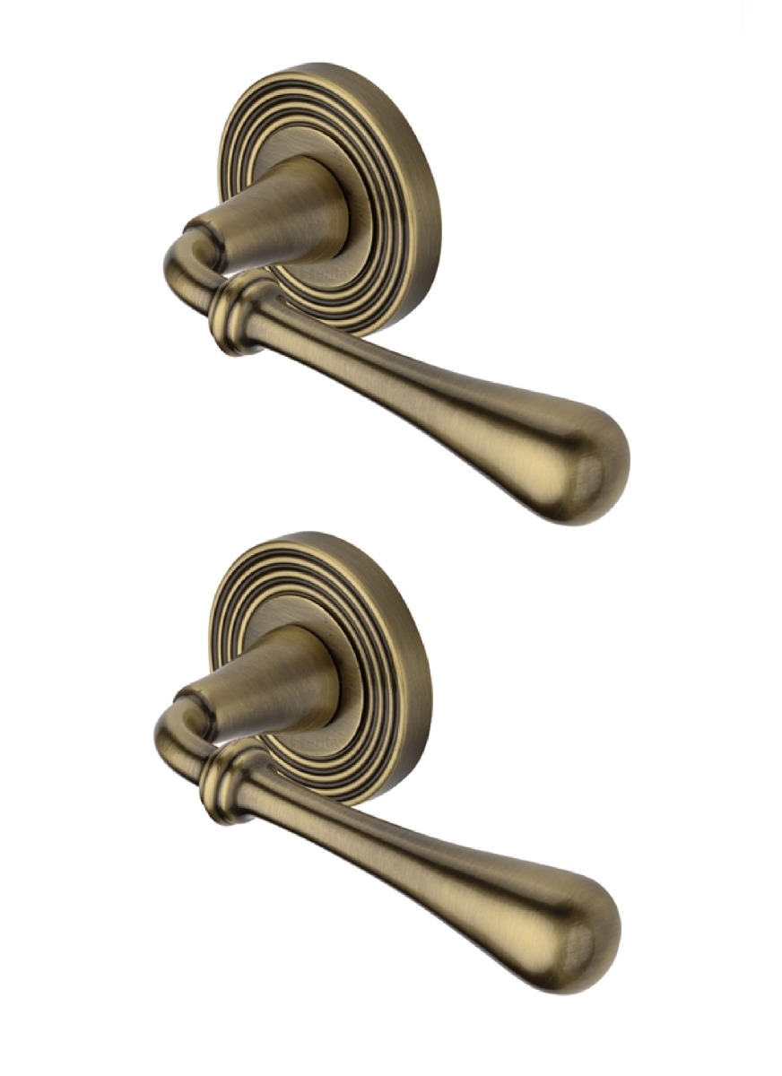 Heritage Brass Door Handle Lever Latch on Round Rose Roma Reeded Design Antique Brass   RR7156-AT